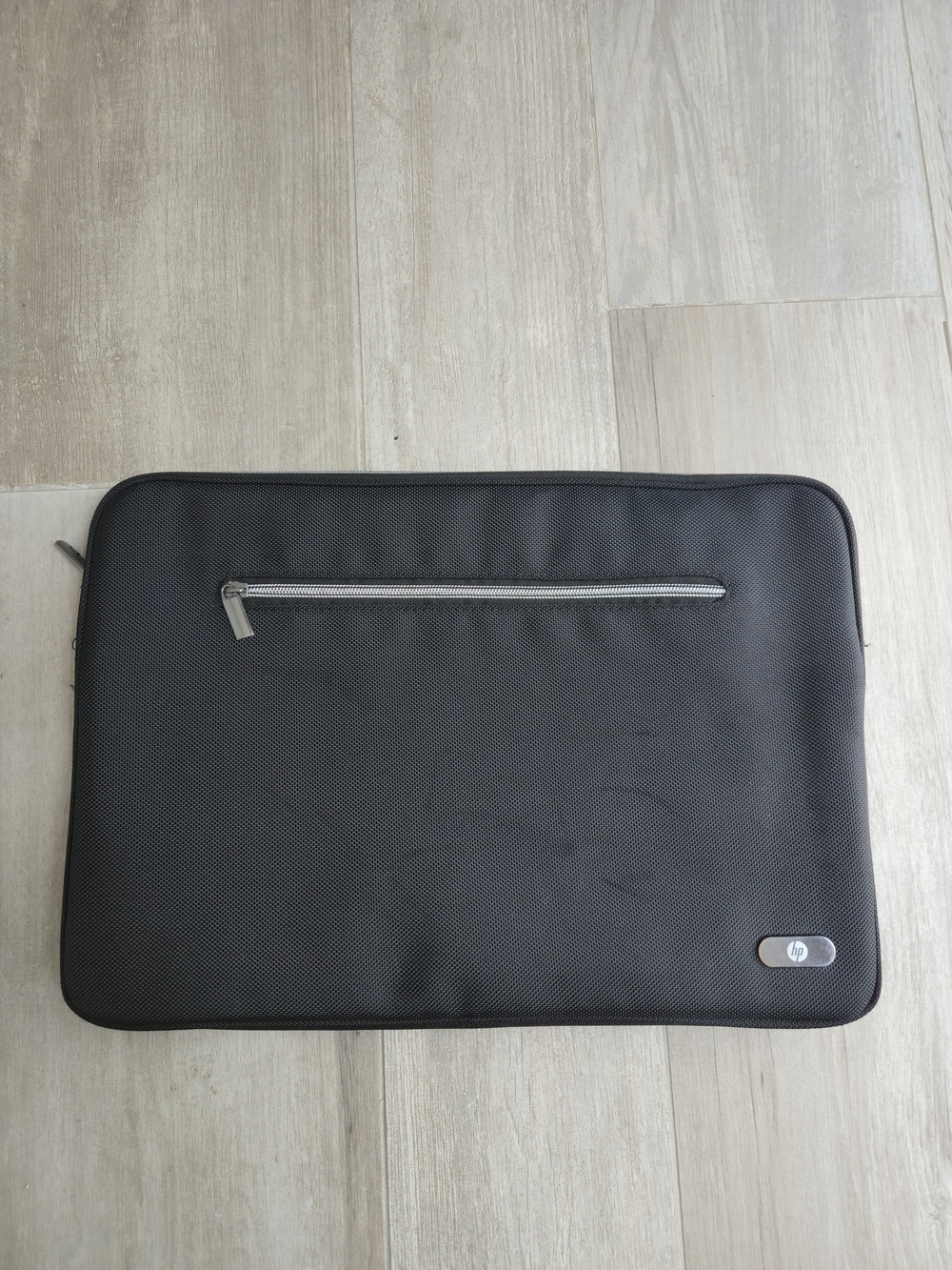 HP Black Laptop Sleeve with Front Zip Pocket and Silver Accent